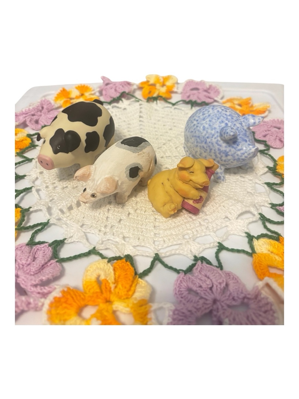 Mini Pig Figurine Set of 4- all ceramic except one that’s wood.